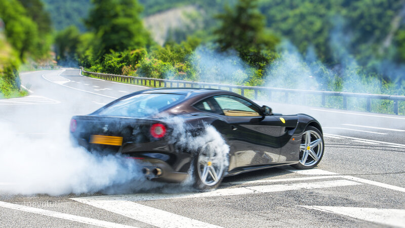 Black Sports Car Burning Rubber — Dramatic
