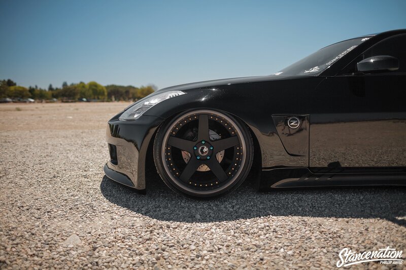 Black Sports Car — Calm, Afternoon, Photograph, Gravel