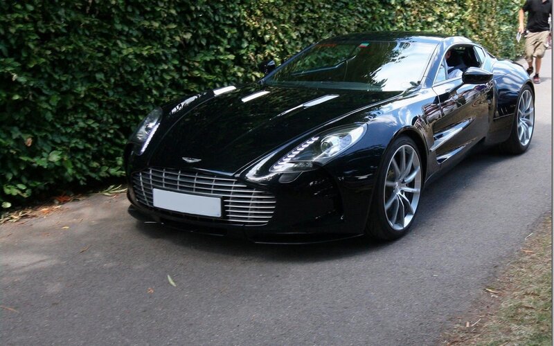 Black Sports Car — Calm, Afternoon, Photograph, Hedge