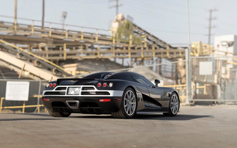 Black Sports Car — Calm, Afternoon, Photograph, Industrial Structure