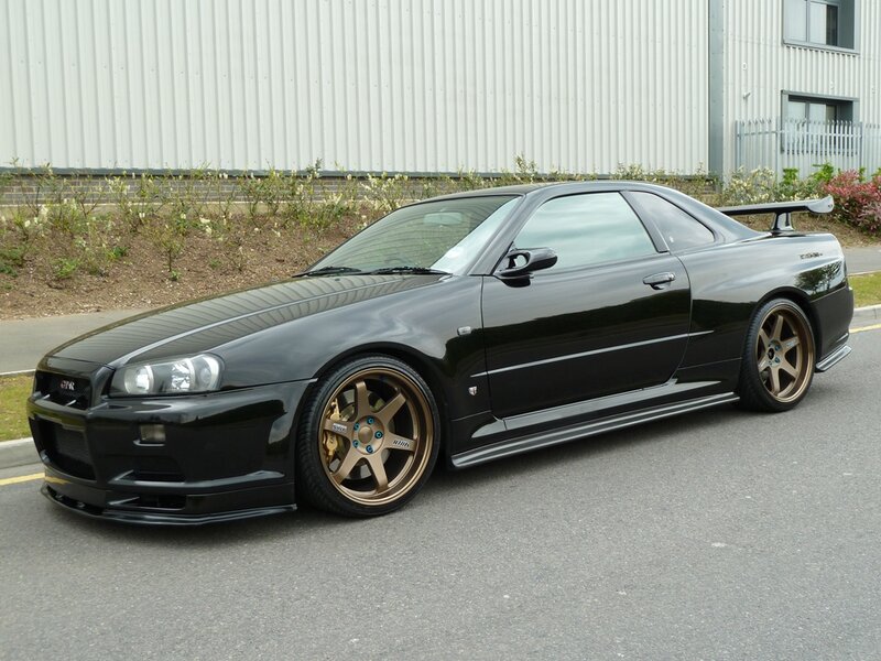 Black Sports Car — Calm, Afternoon, Photograph, Wheels