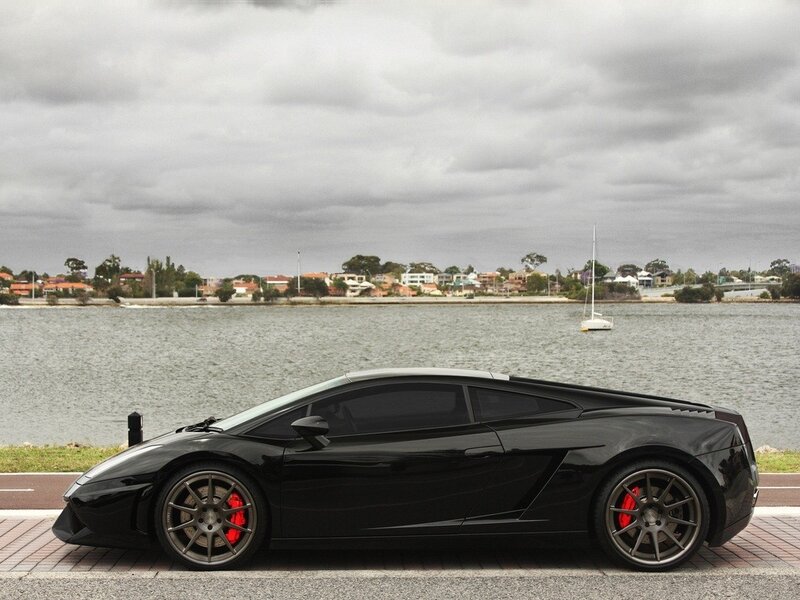 Black Sports Car — Calm, Photograph, Water, Sailboat