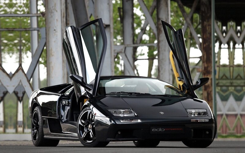 Black Sports Car — Dramatic, Afternoon, Photograph, Car Doors, Bridge
