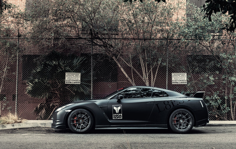 Black Sports Car — Dramatic, Afternoon, Photograph, Fence