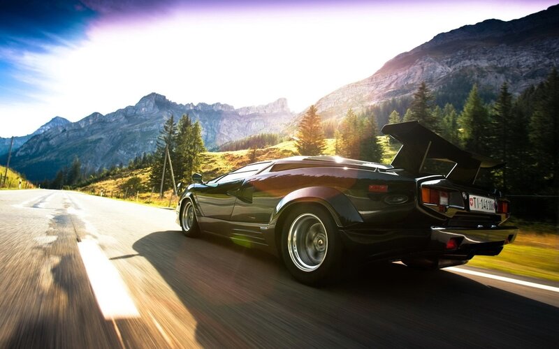 Black Sports Car — Dramatic, Afternoon, Photograph, Mountains, Road, Trees