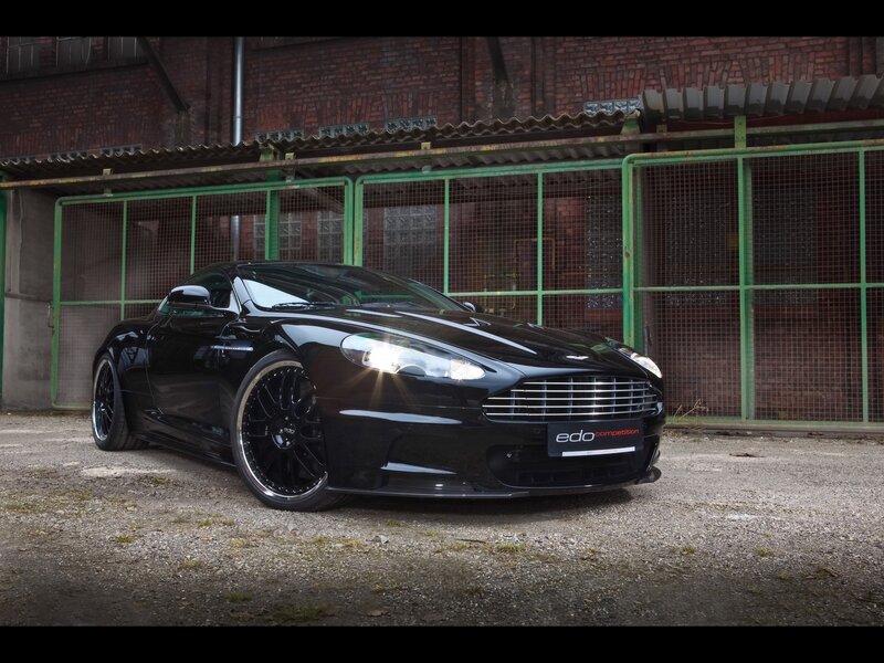 Black Sports Car — Dramatic, Photograph, Brick Building