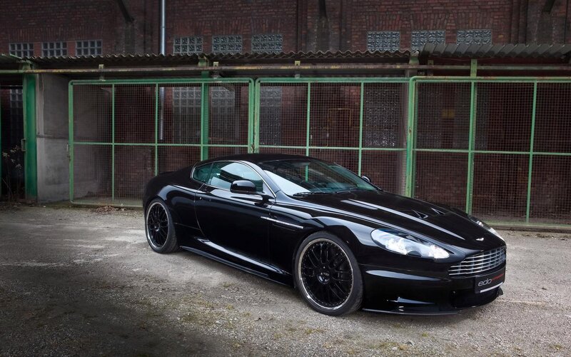 Black Sports Car — Dramatic, Photograph, Building, Fence