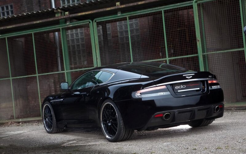 Black Sports Car — Dramatic, Photograph, Building, Gravel