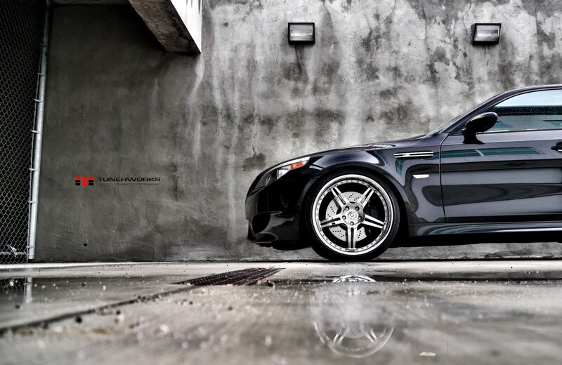 Black Sports Car — Dramatic, Photograph, Car Wheel, Concrete Wall