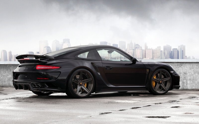 Black Sports Car — Dramatic, Photograph, City Skyline, Concrete Surface
