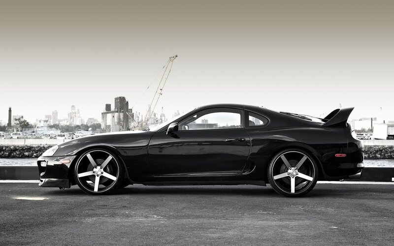 Black Sports Car — Dramatic, Photograph, City Skyline, Crane, Water, Gray