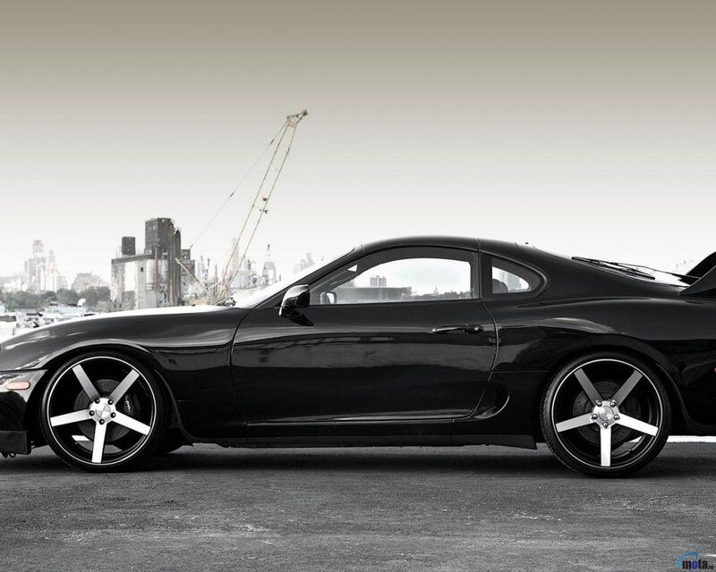 Black Sports Car — Dramatic, Photograph, City Skyline
