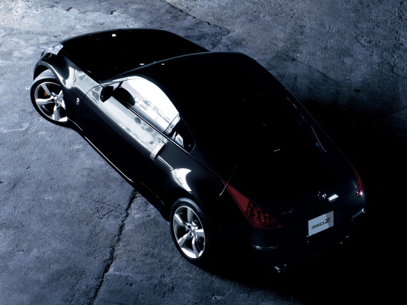 Black Sports Car — Dramatic, Photograph, Concrete Floor