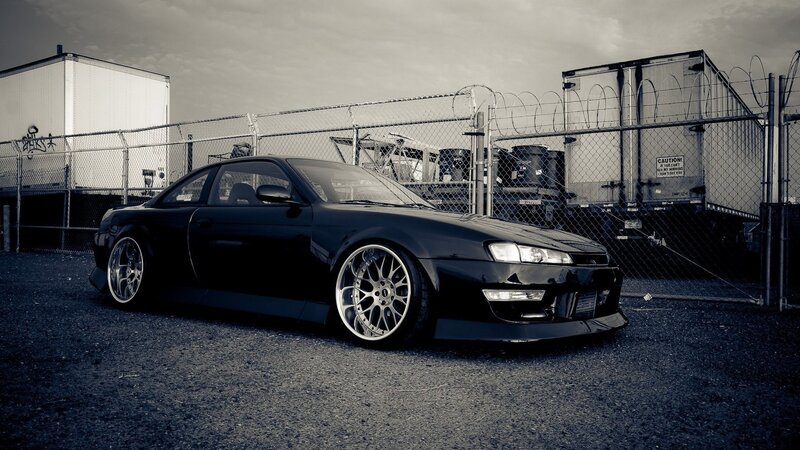 Black Sports Car — Dramatic, Photograph, Fence, Trailer