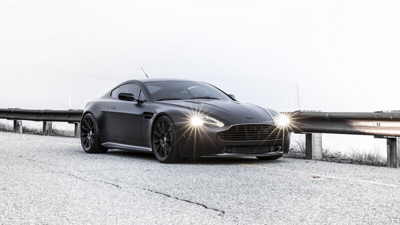Black Sports Car — Dramatic, Photograph, Guardrail