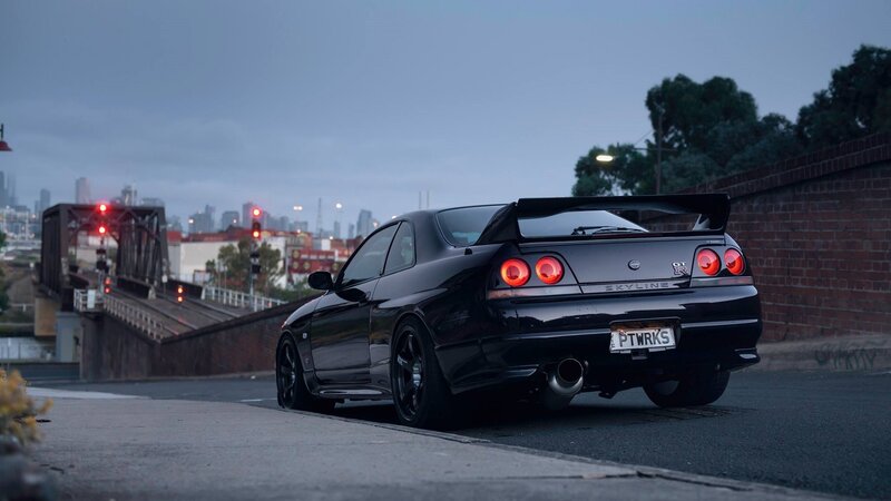 Black Sports Car — Dramatic, Sunset, Photograph, City Skyline, Bridge
