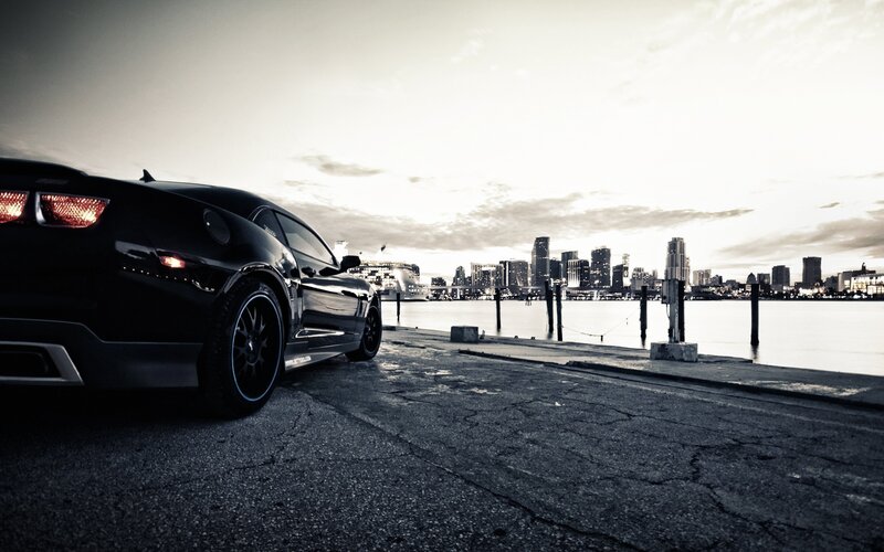 Black Sports Car — Dramatic, Sunset, Photograph, City Skyline, Water, Dock, Gray