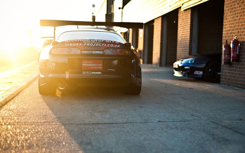 Black Sports Car — Dramatic, Sunset, Photograph, Garage