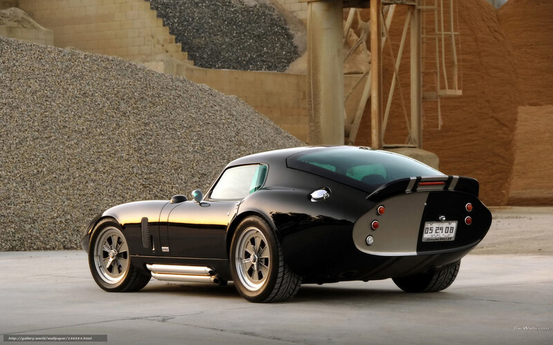 Black Sports Car — Dramatic, Sunset, Photograph, Gravel Pile, Concrete Wall