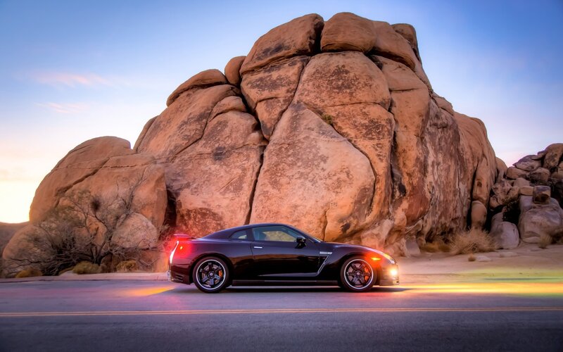 Black Sports Car — Dramatic, Sunset, Photograph, Rock Formation
