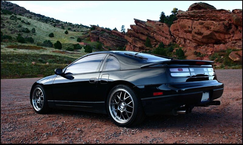 Black Sports Car — Dramatic, Sunset, Photograph, Rock Formations