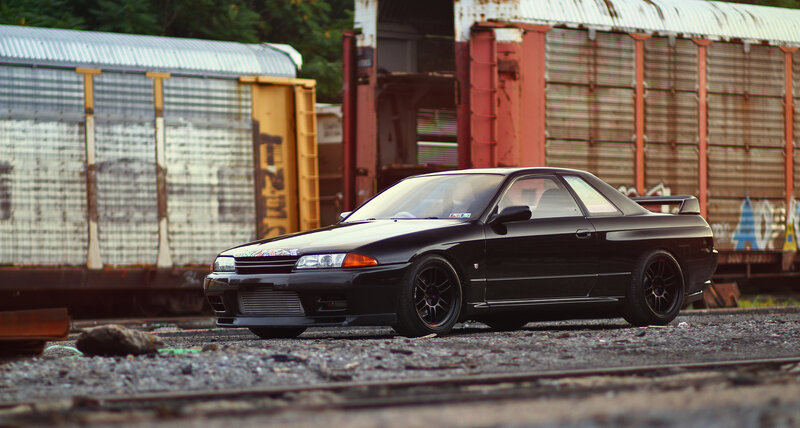 Black Sports Car — Dramatic, Sunset, Photograph, Train Cars