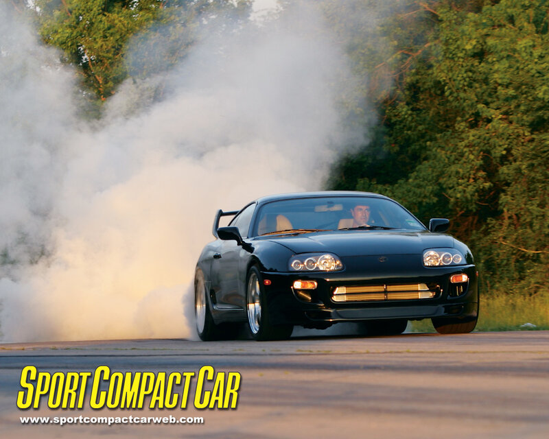 Black sports car drifting