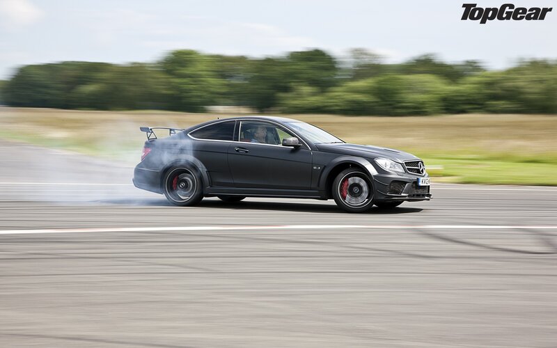 Black Sports Car Drifting — Gray, Dynamic, Afternoon