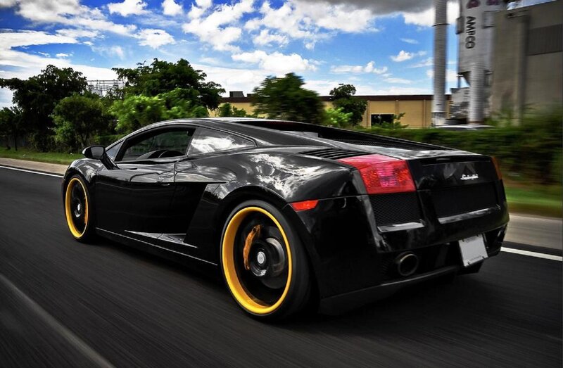 Black Sports Car — Dynamic, Afternoon, Photograph, Road, Trees, Building