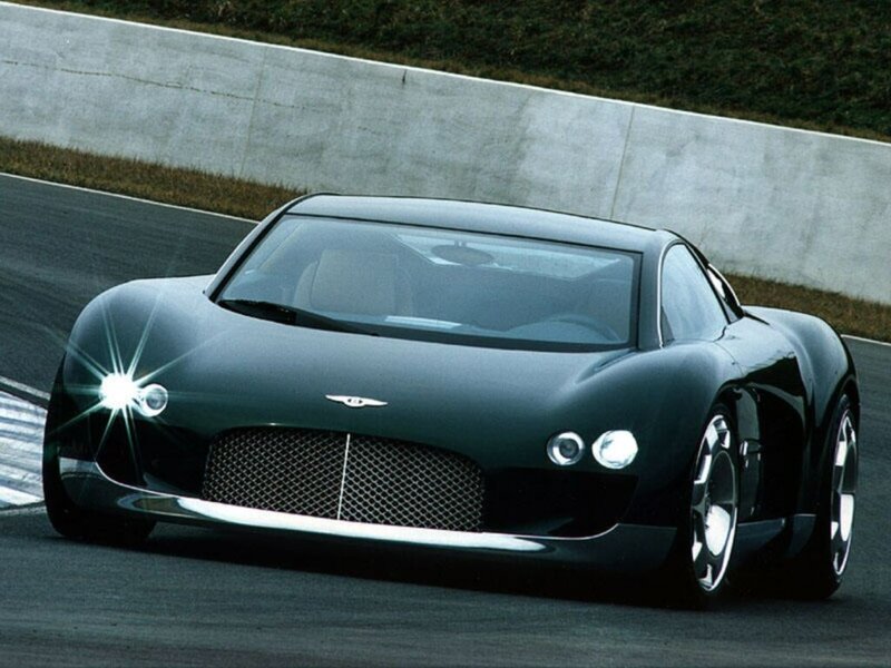 Black Sports Car — Dynamic, Photograph, Race Track, Concrete Wall