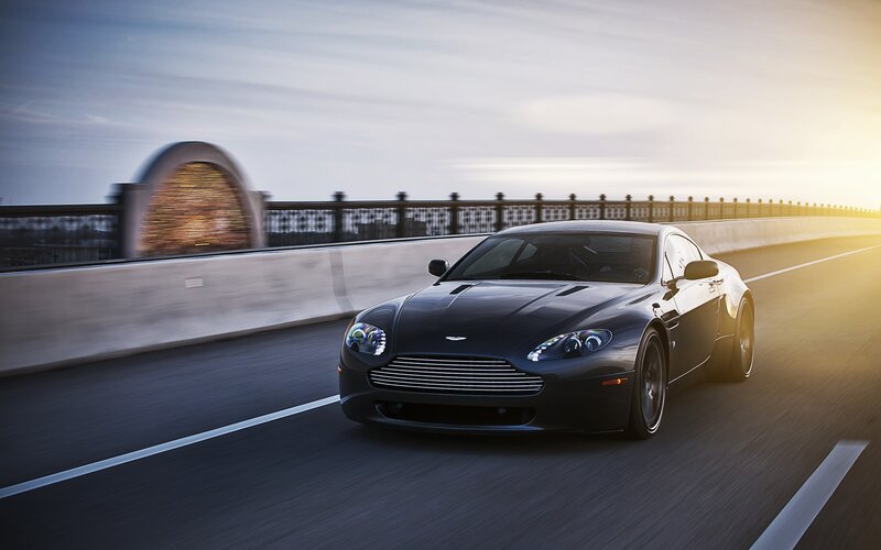 Black Sports Car — Dynamic, Sunset, Photograph, Bridge, Road, Sunlight, Gray