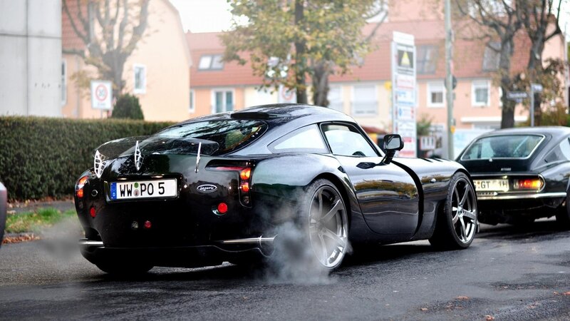Black Sports Car Emitting Smoke