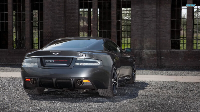 Black Sports Car — Gray, Dramatic, Afternoon, Photograph, Brick Building