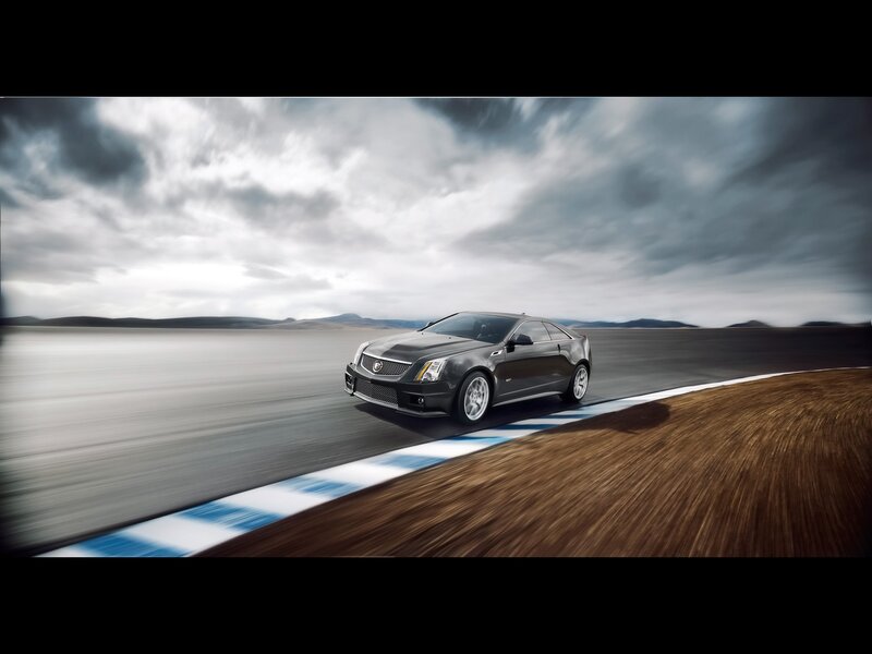 Black Sports Car — Gray, Dramatic, Photograph, Race Track, Cloudy Sky