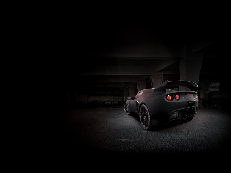 Black sports car in dark garage