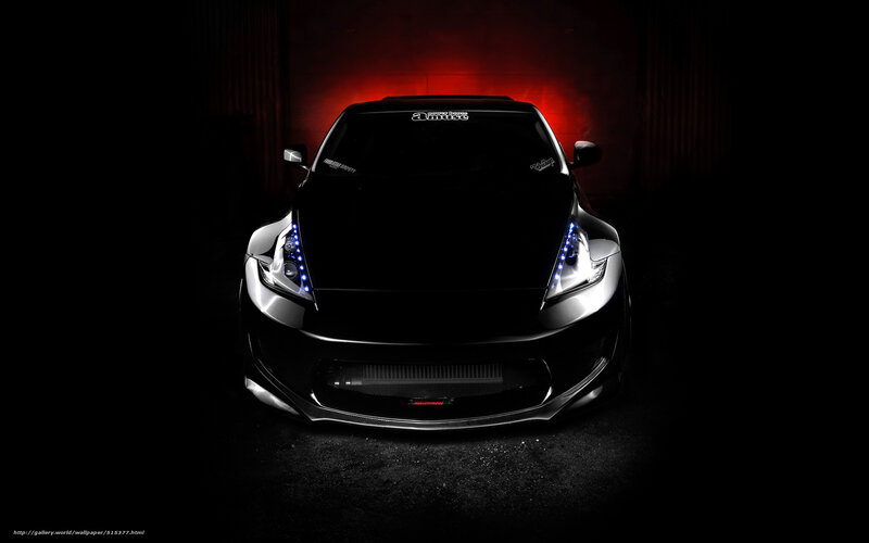 black sports car in dark room