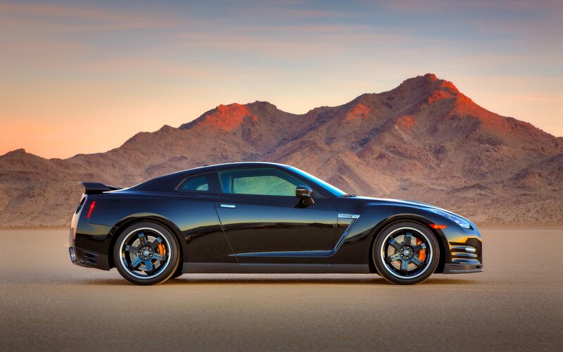 Black sports car in desert