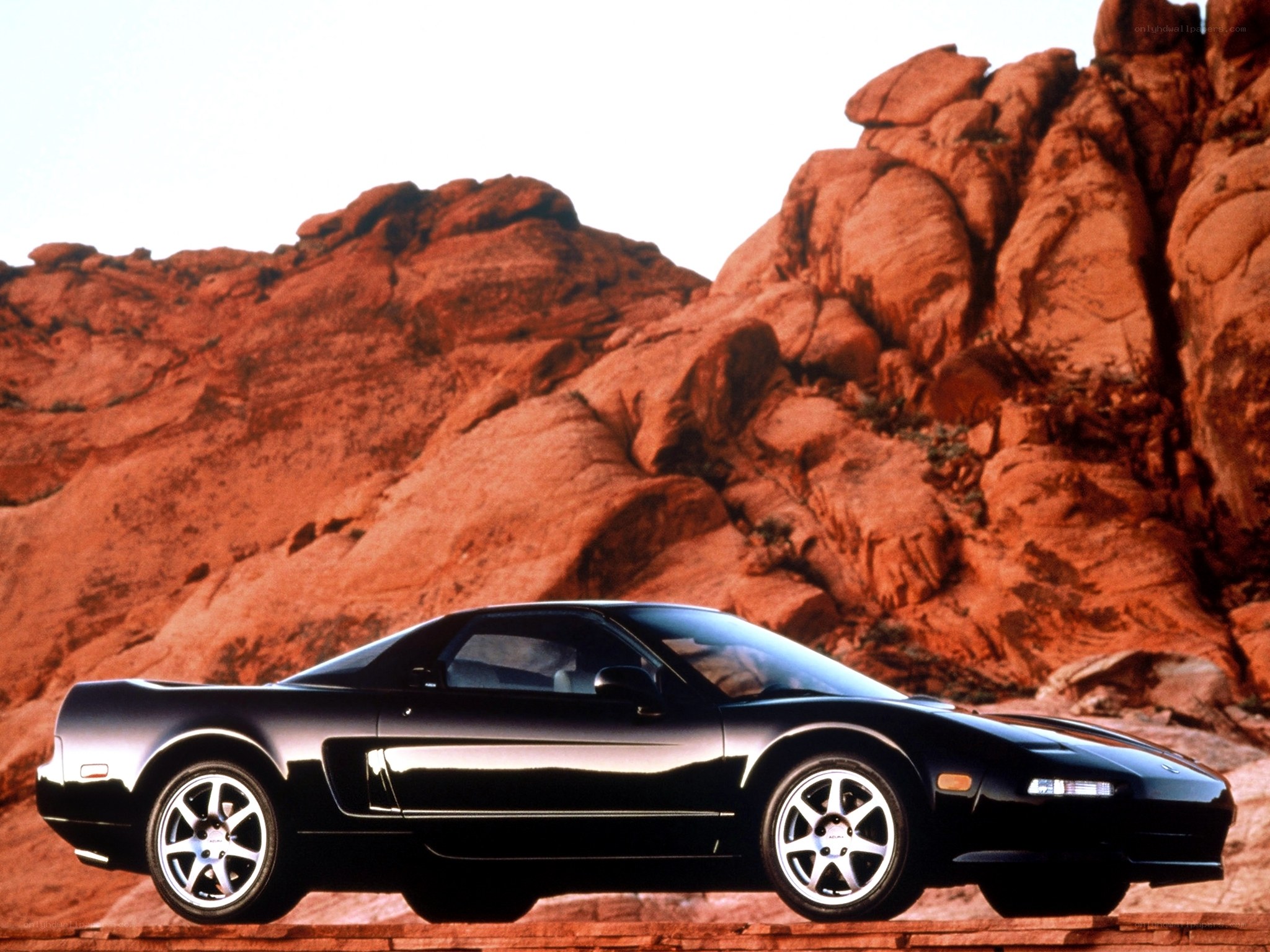 Black sports car in desert
