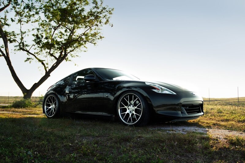 Black sports car in field