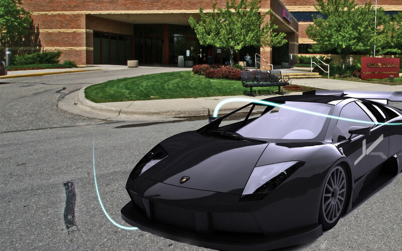 Black sports car in front of clinic