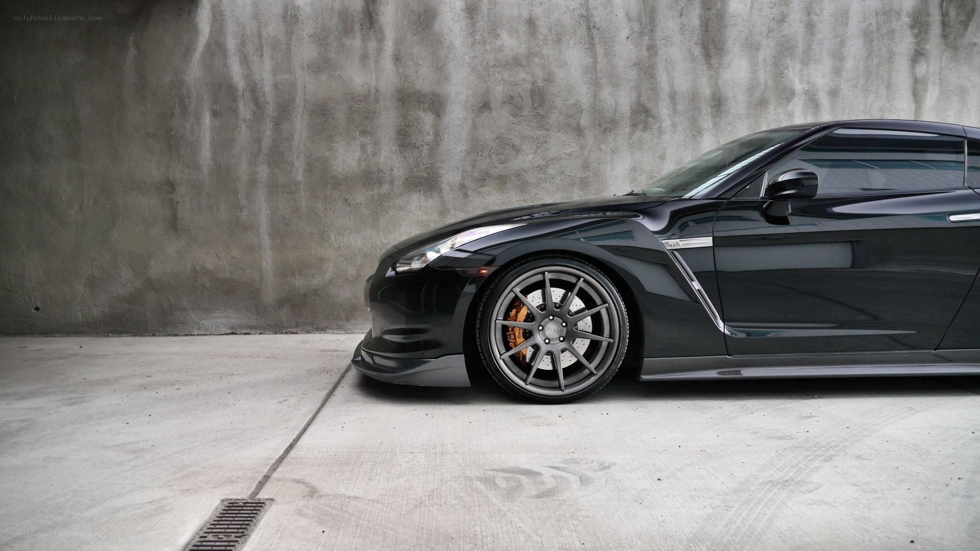 Black sports car in garage