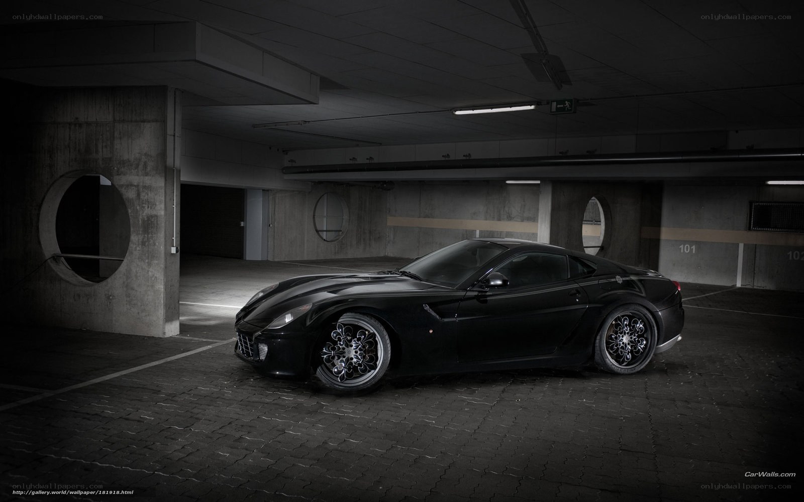 Black sports car in garage