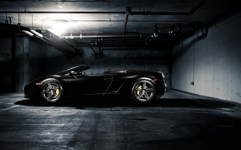 Black sports car in garage