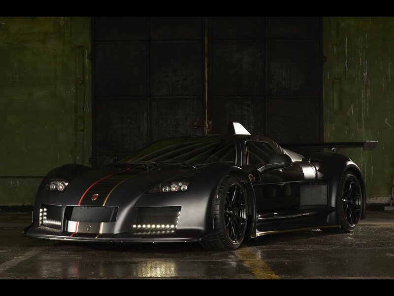Black sports car in garage