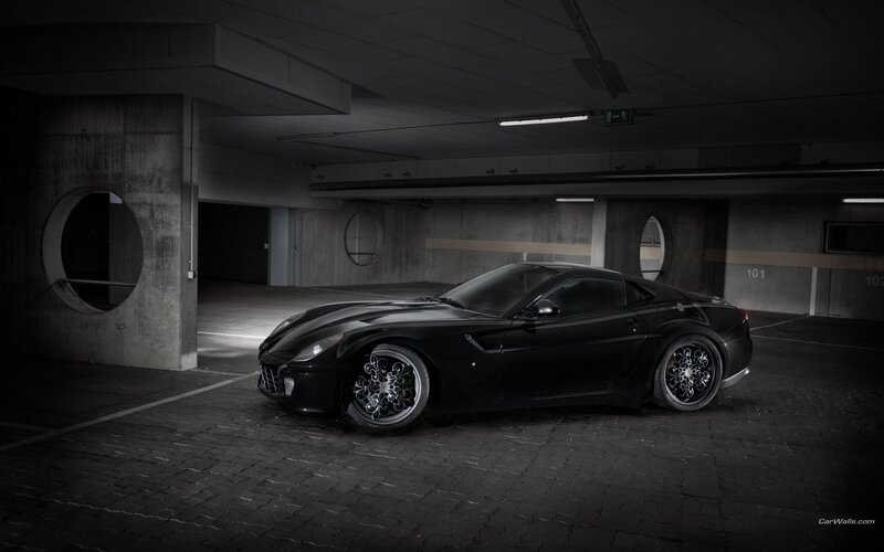 Black sports car in garage