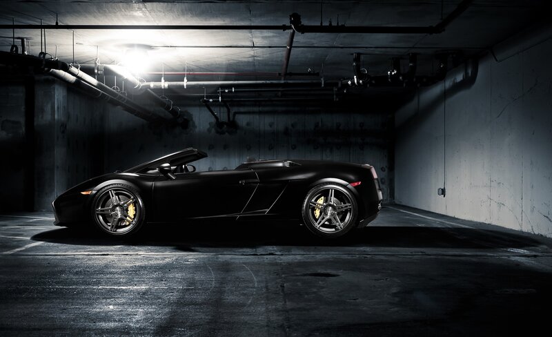 Black sports car in garage