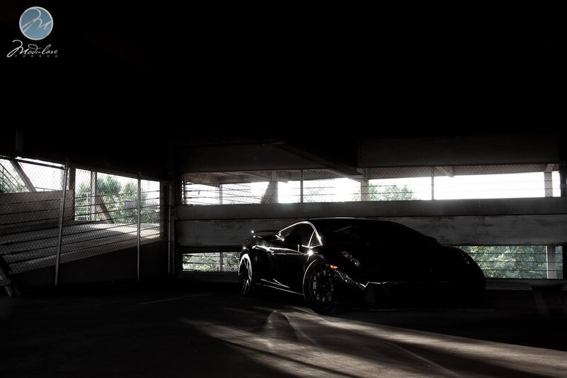 Black sports car in garage