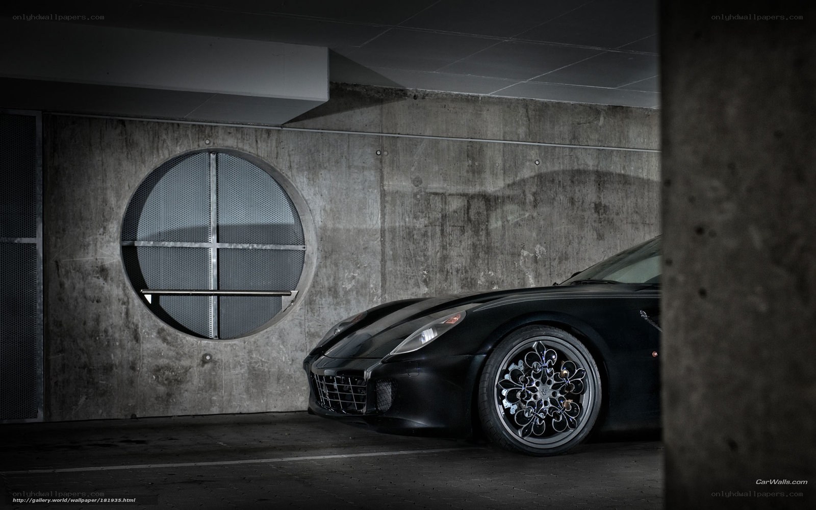 Black sports car in garage