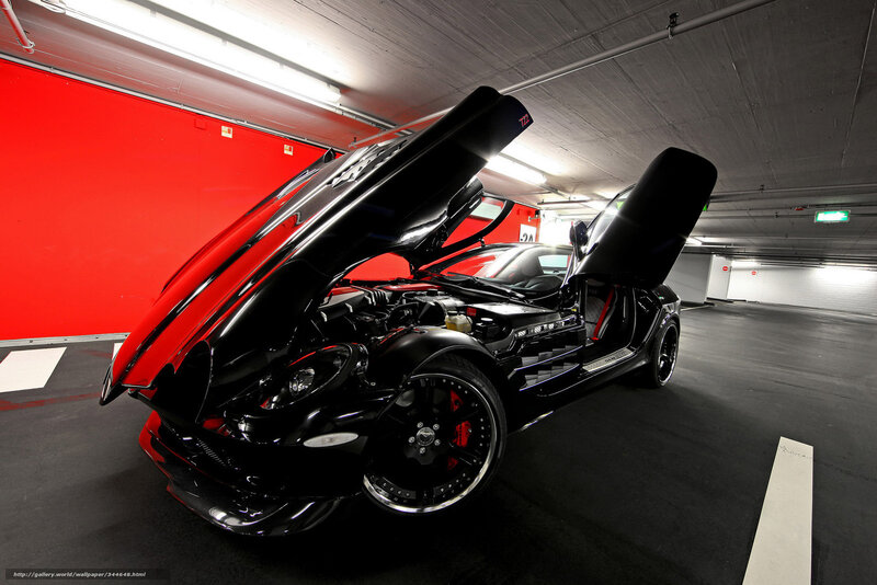 Black sports car in garage