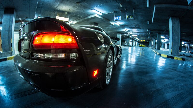 Black Sports Car in Garage — Dramatic, Night